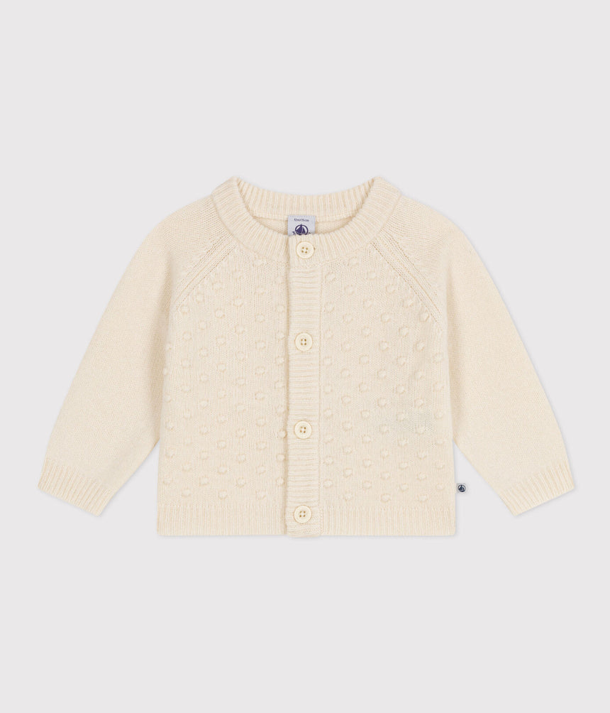 KNITTED CARDIGAN CONTAINING WOOL FOR BABIES.