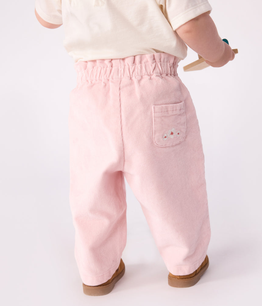BABIES' PLAIN VELOUR TROUSERS WITH AN EMBROIDERED BACK POCKET