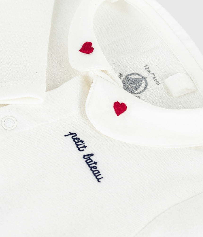 BABIES BODY WITH AN EMBROIDERED COLLAR AND A MESSAGE ON THE CHEST