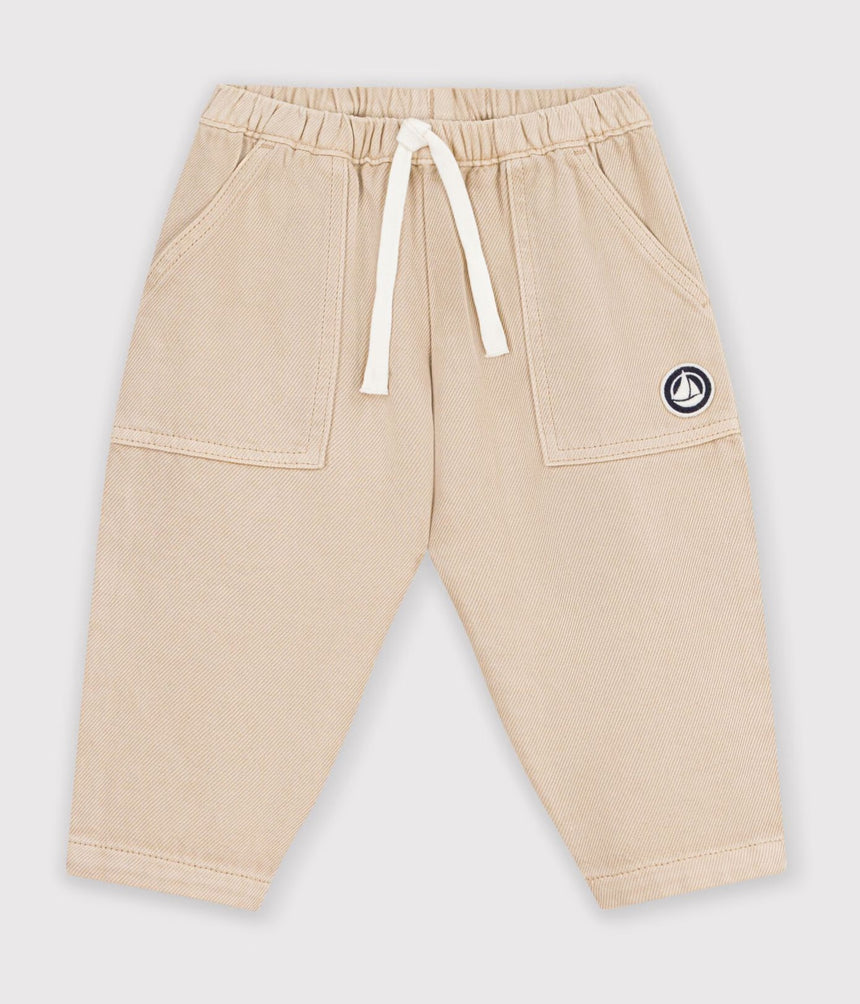 BABIES' CARGO-STYLE TROUSERS IN PLAIN COTTON WITH A BADGE