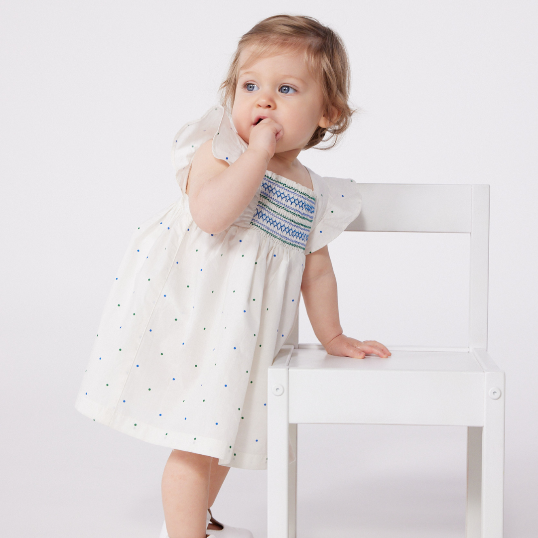 BABIES' WHITE COTTON DRESS AND BLOOMERS PRINTED WITH SPOTS