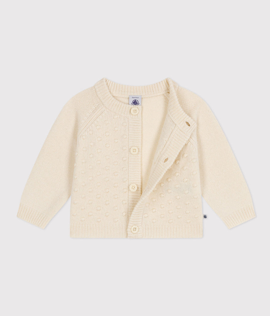 KNITTED CARDIGAN CONTAINING WOOL FOR BABIES.