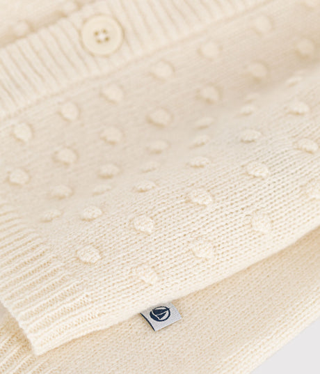 KNITTED CARDIGAN CONTAINING WOOL FOR BABIES.