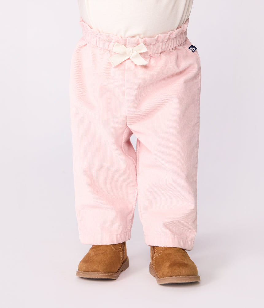 BABIES' PLAIN VELOUR TROUSERS WITH AN EMBROIDERED BACK POCKET