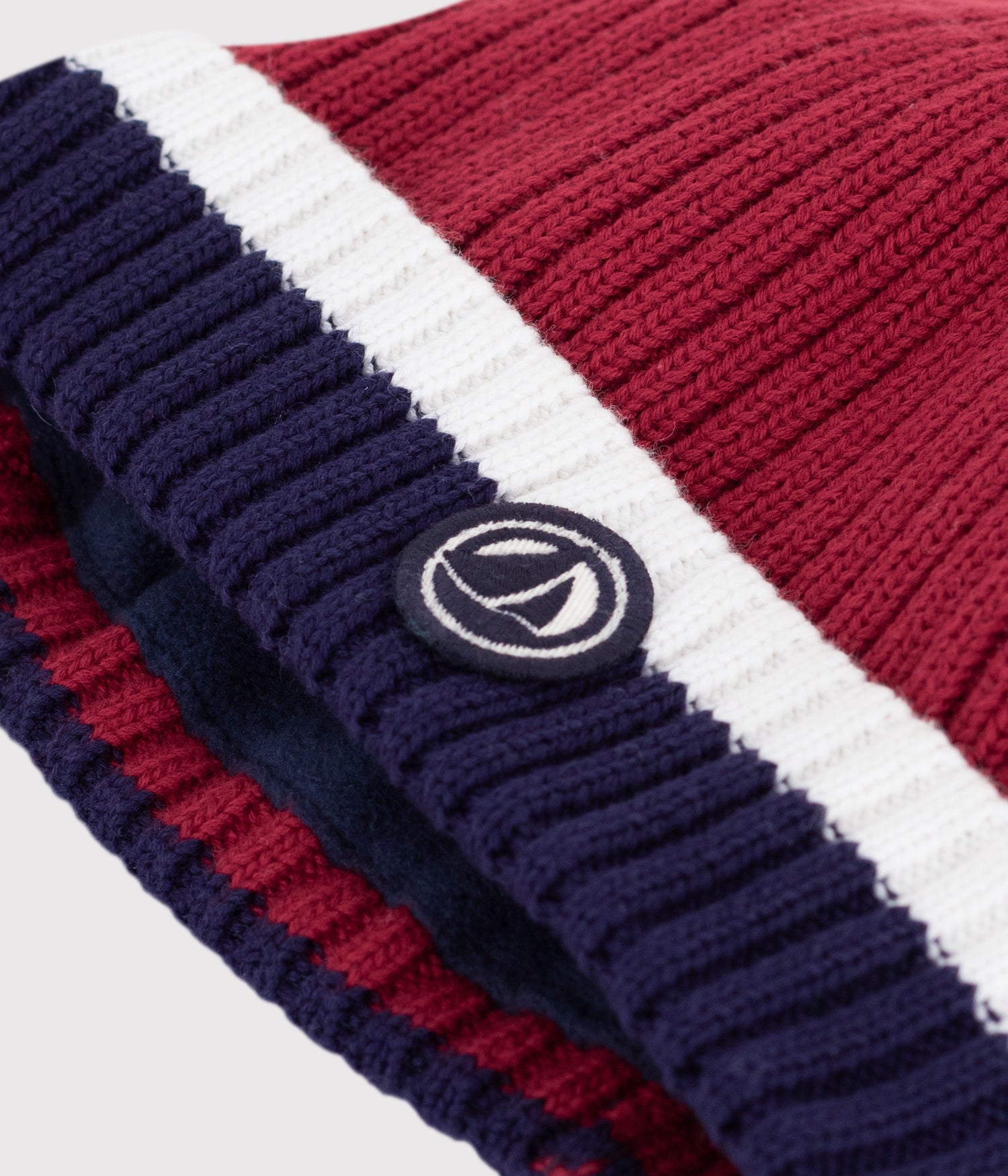 BABIES' KNITTED BEANIE WITH A FLEECE LINING BABIES' KNITTED BEANIE WITH A FLEECE LINING