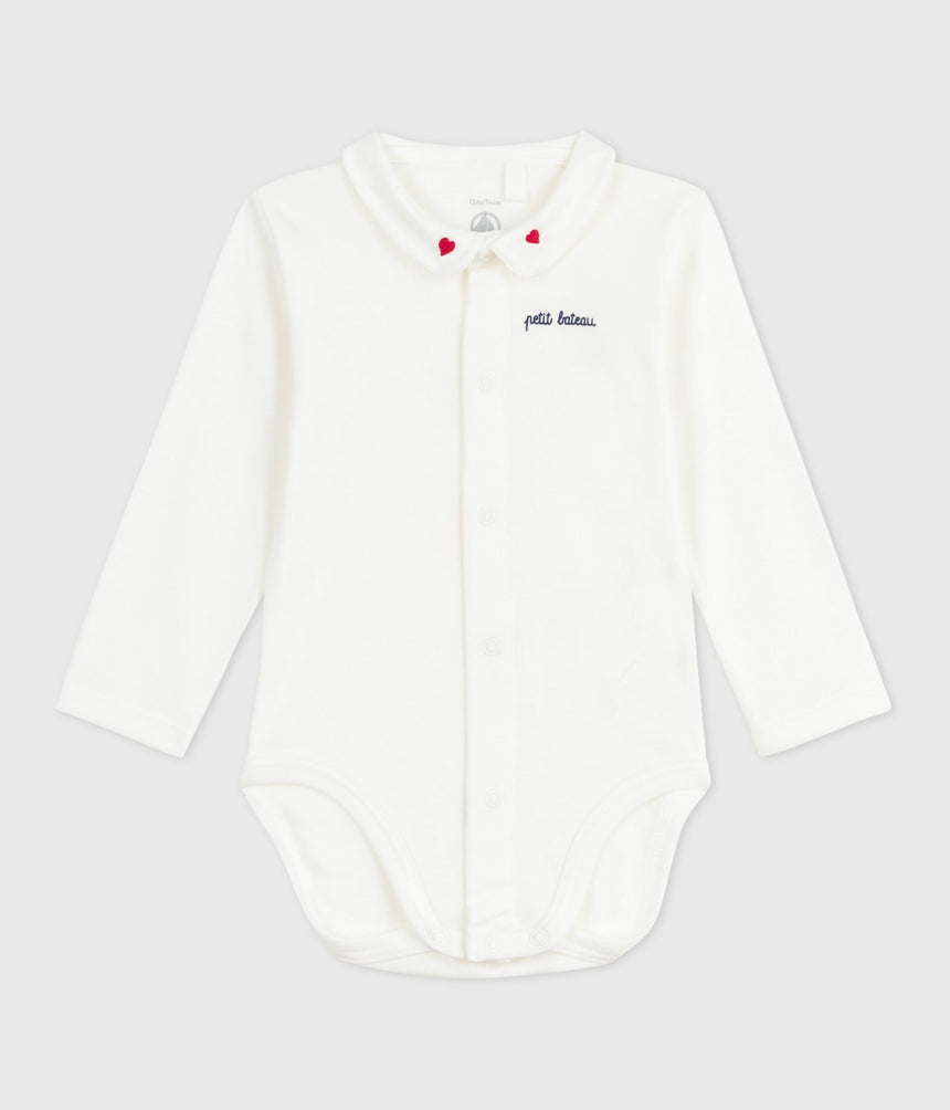 BABIES BODY WITH AN EMBROIDERED COLLAR AND A MESSAGE ON THE CHEST
