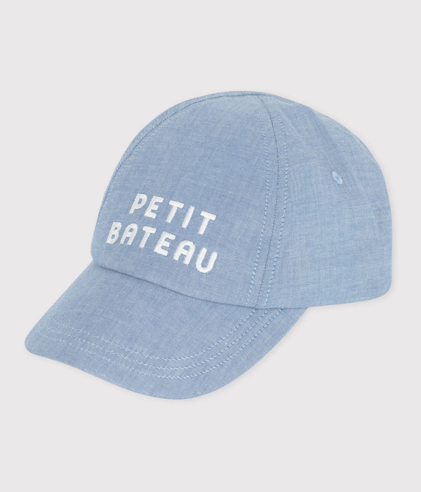 BABIES’ PETIT BATEAU CAP IN LIGHT-COLOURED DENIM