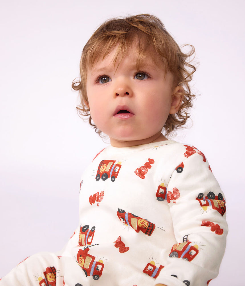 BABIES' PYJAMA SUIT IN TUBE KNIT FABRIC WITH A PRINTED FIREFIGHTER DESIGN AND A BACK OPENING