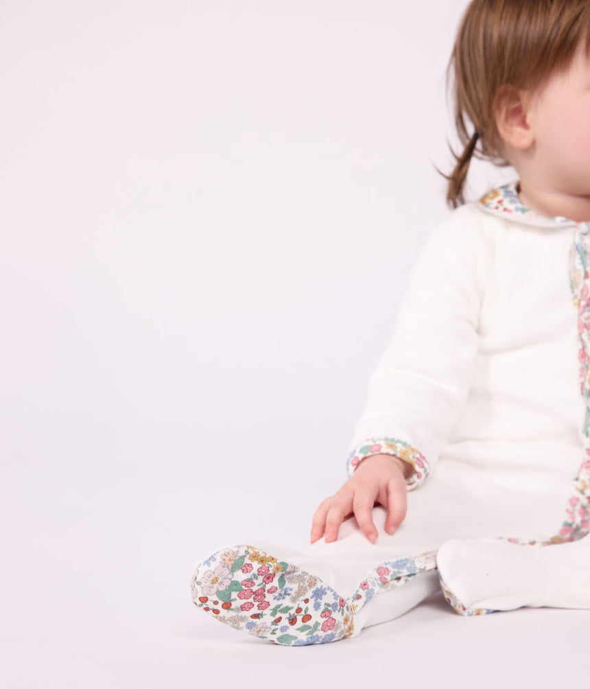 BABIES' PYJAMA SUIT IN PLAIN VELOUR WITH A COLLAR AND FLORAL PRINT DETAIL