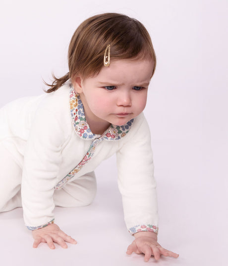 BABIES' PYJAMA SUIT IN PLAIN VELOUR WITH A COLLAR AND FLORAL PRINT DETAIL