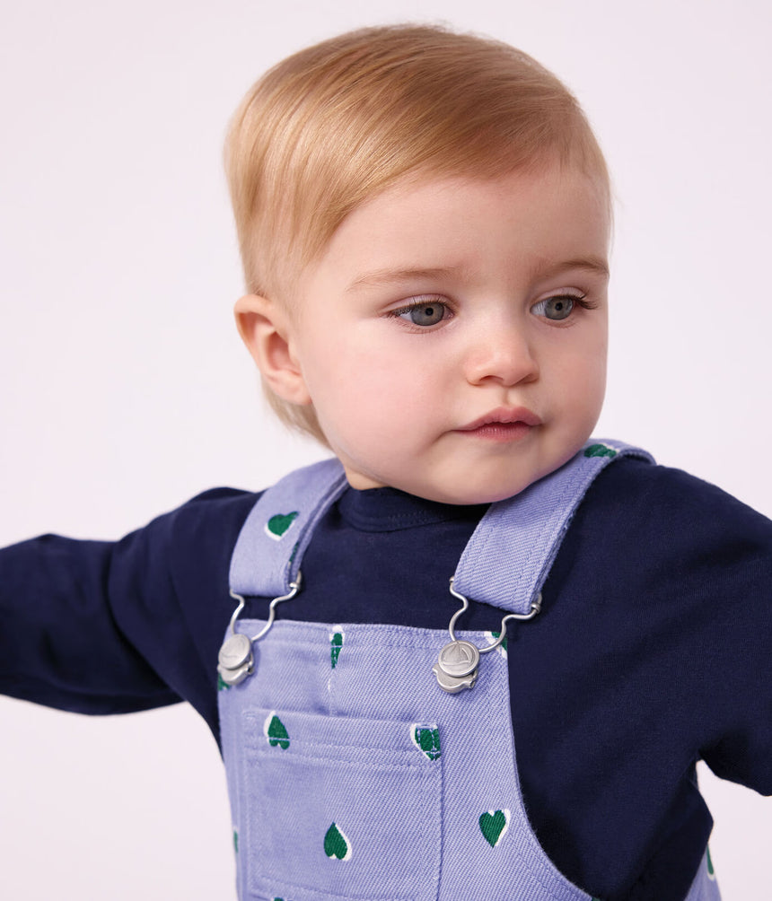 BABIES' DUNGAREES IN SERGE WITH LONG LEGS AND A HEART PRINT