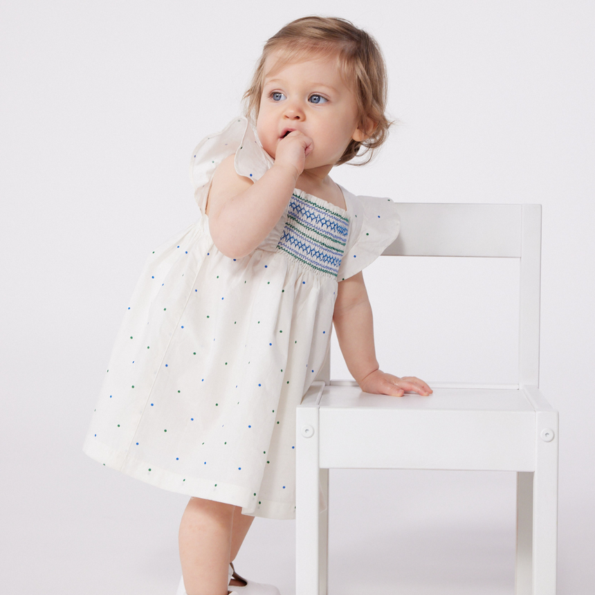 BABIES' WHITE COTTON DRESS AND BLOOMERS PRINTED WITH SPOTS