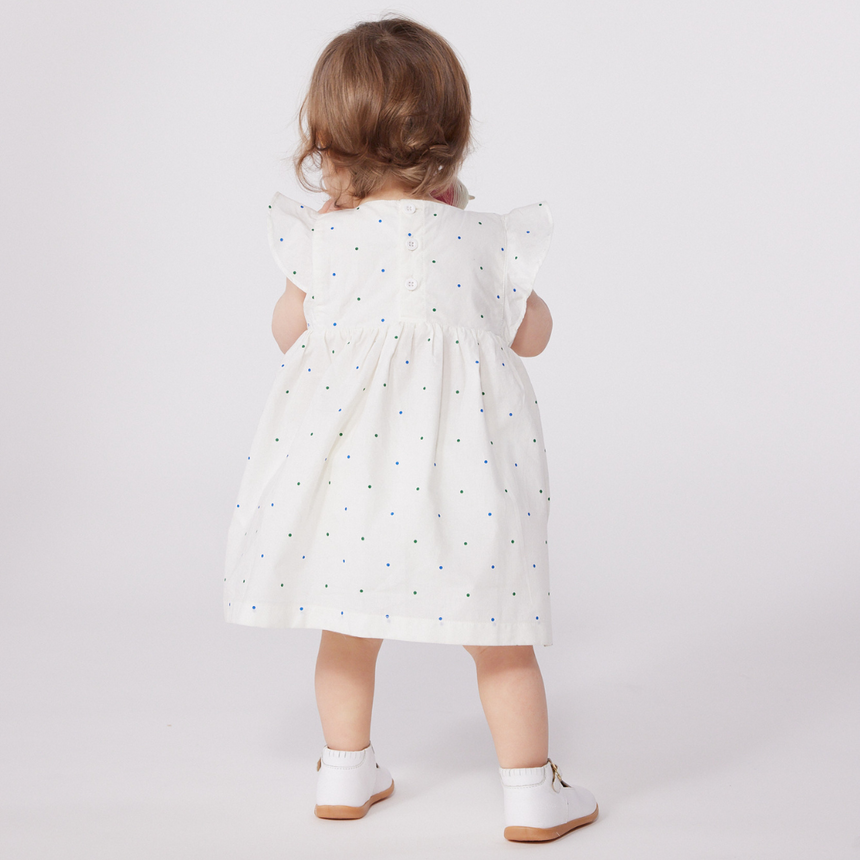 BABIES' WHITE COTTON DRESS AND BLOOMERS PRINTED WITH SPOTS