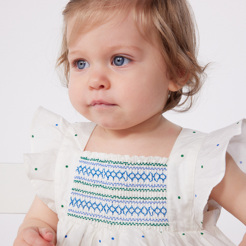 BABIES' WHITE COTTON DRESS AND BLOOMERS PRINTED WITH SPOTS